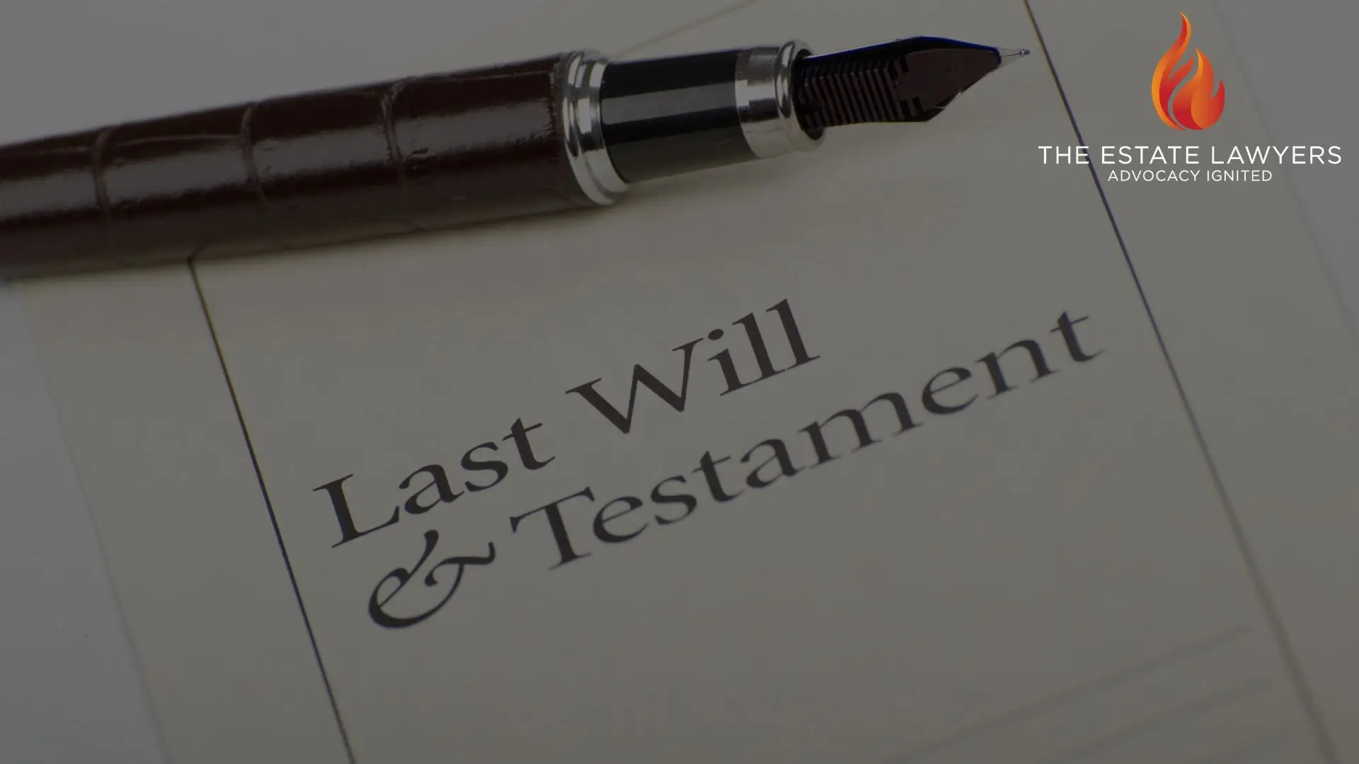 Fountain pen resting on a document titled "Last Will & Testament" with The Estate Lawyers logo visible