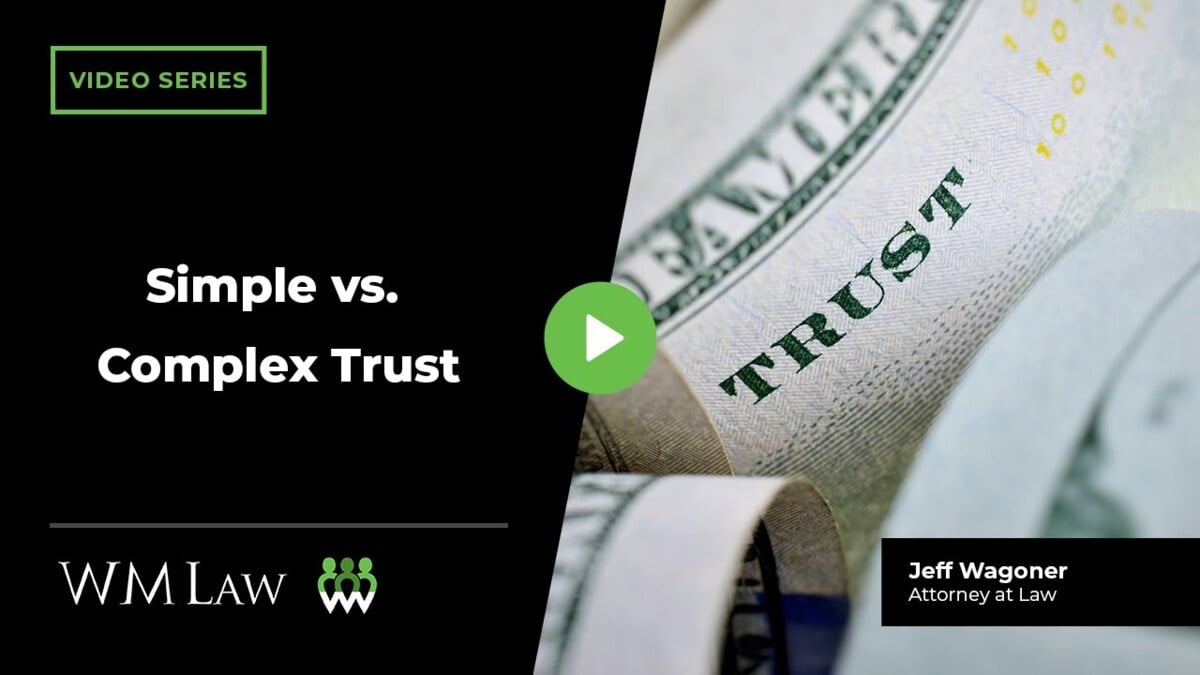 A close-up of US currency with "TRUST" text visible, next to the WM Law logo and Jeff Wagoner, Attorney at Law credit