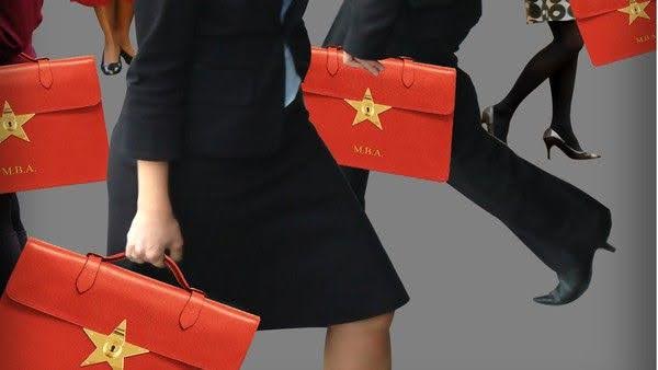 Female professionals in business attire holding red briefcases with gold stars and "MBA" text against a gray background